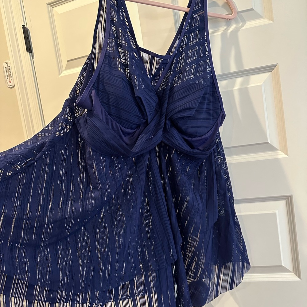 Plus size 2 piece swim suit. Fits great. Never worn. Couldn’t return.